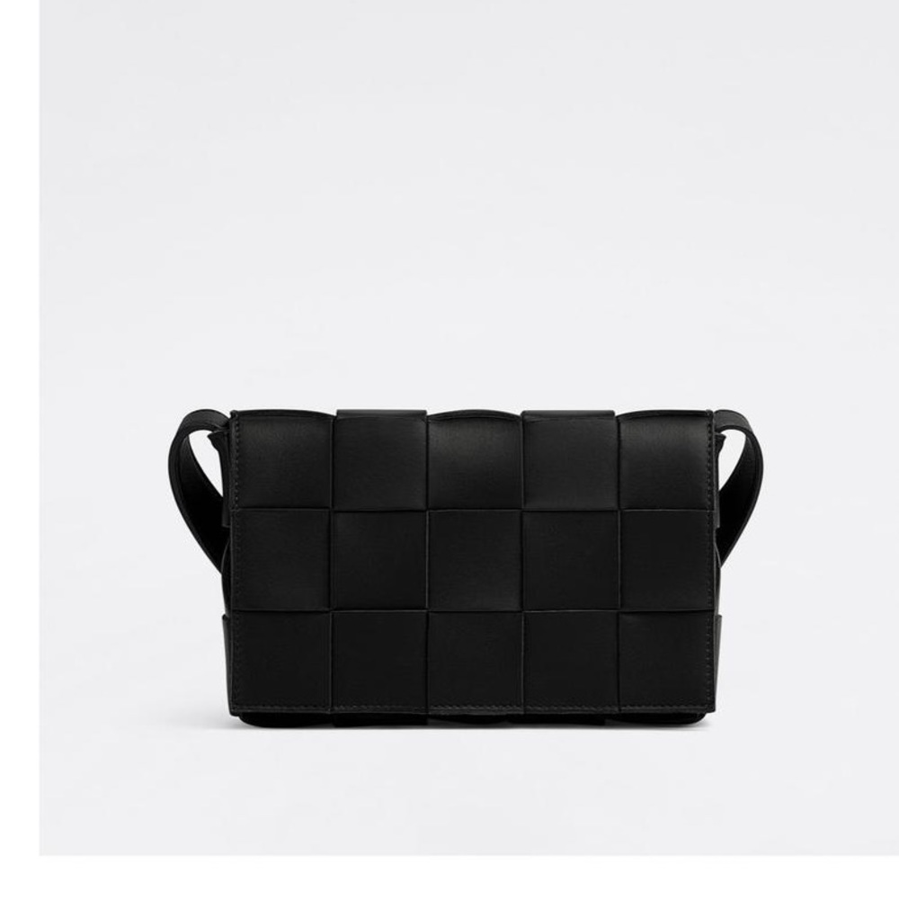 Bottega Veneta Cassette crossbody bag in black.
